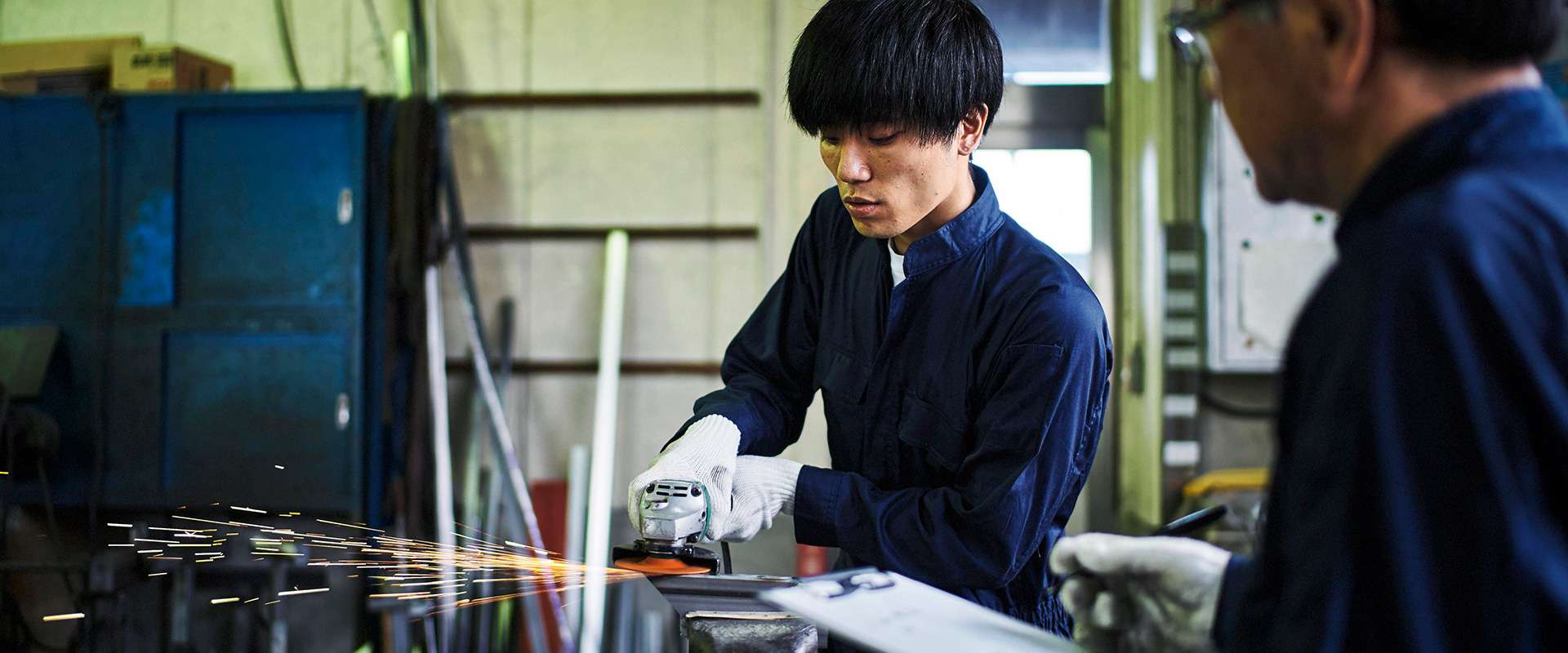 修設備株式会社のロゴ